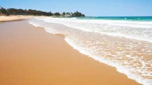 Lapping Waves on a Beach in Australia | Tours of Australia