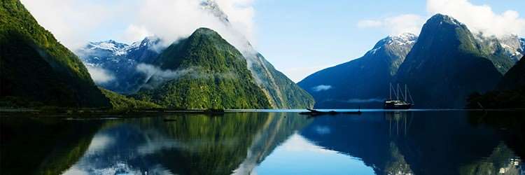 New Zealand lake water mountains boats view landscape sky clouds reflection beautiful Best Country category Telegraph Travel Awards London Distant Journeys escorted coach tours holidays destination Australia Auckland Wellington 