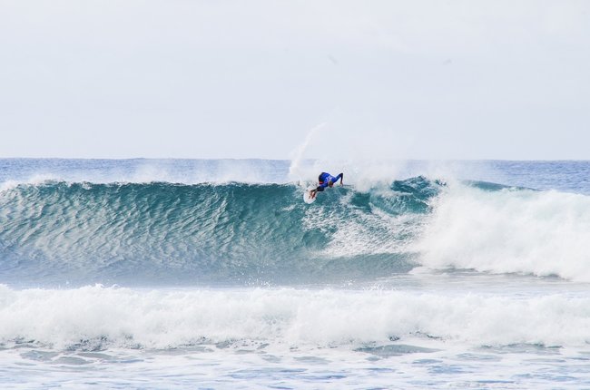 surfer on white waves Bells Beach Australia