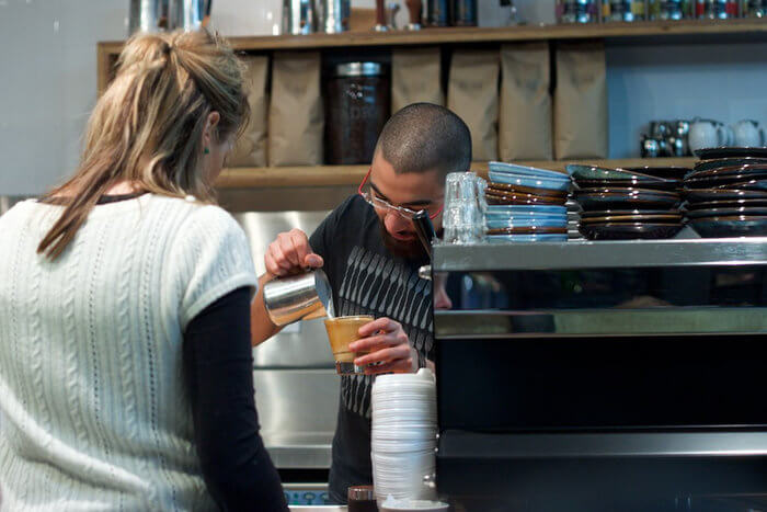 barista serving coffee melbourne australia