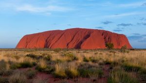 Uluru ayers rock grass and blue skies