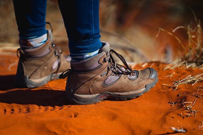 walking boots on red sand uluru