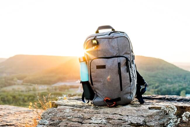 backpack on mountain with shinning sun