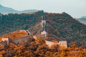 great wall of china with autumnal trees