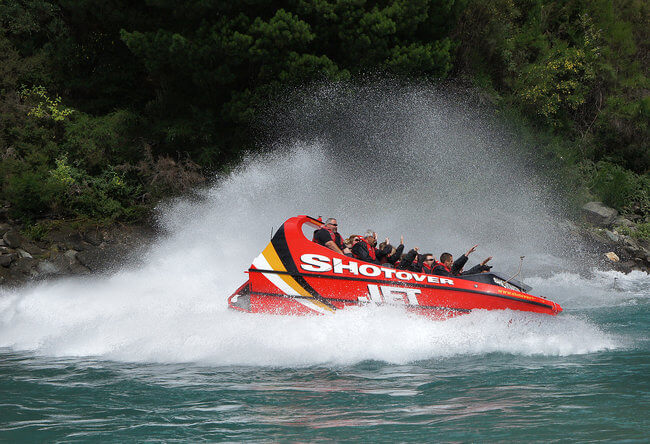 shot over jet splashing water Queenstown New Zealand