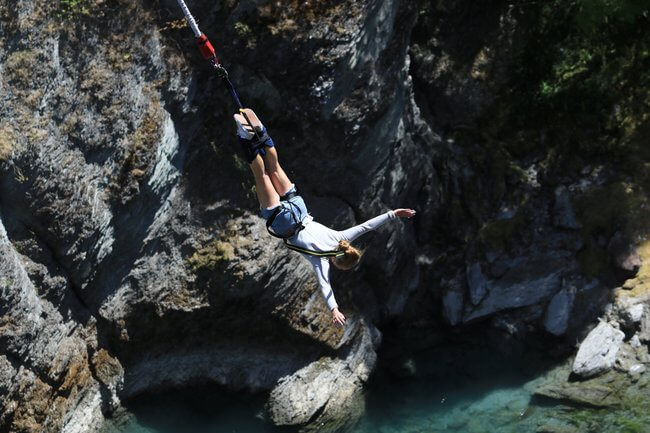 girl bungee jumping kawarau bridge New Zealand