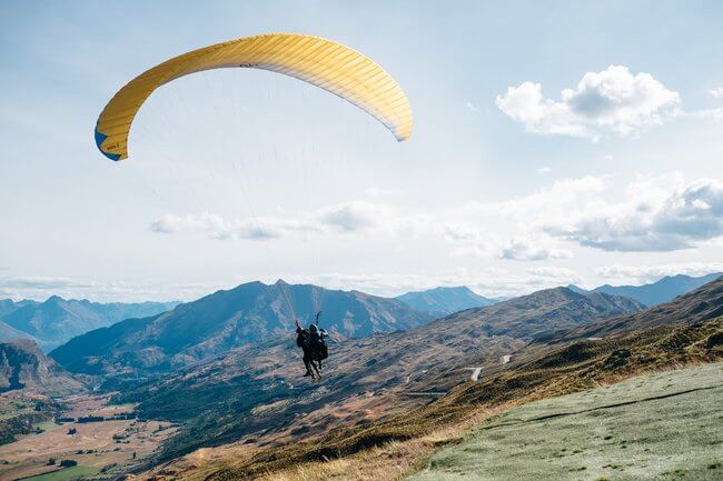 paragliding flight mountains Queenstown New Zealand