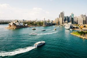sydney harbour with opera house and boats daytime