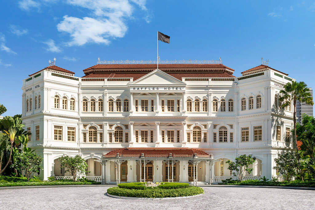 sunny exterior front garden view of Raffles hotel Singapore