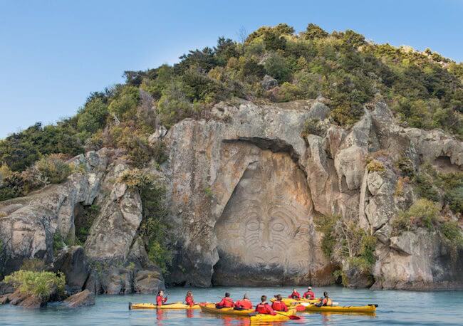 maori rock carvings kayak tour in lake taupo new zealand