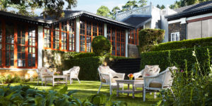 Tables and chairs set out in the garden of the Jetwing St Andrews hotel, Sri Lanka