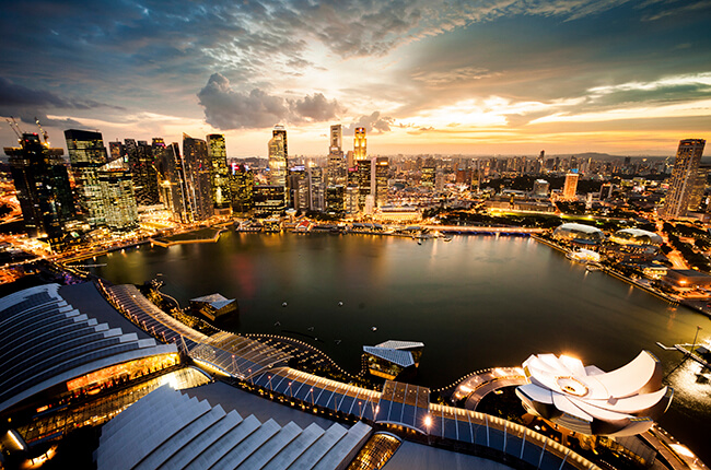Aerial view of Marina Bay, Singapore at dawn, with the famous Art Science museum in foreground