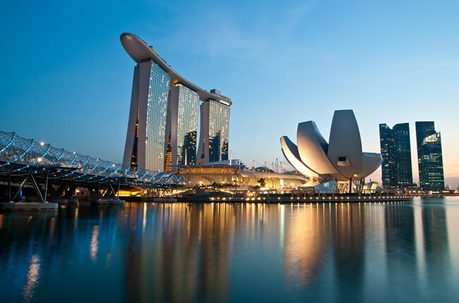 Aerial view of Marina Bay, Singapore at dawn, with the famous Art Science museum in foreground