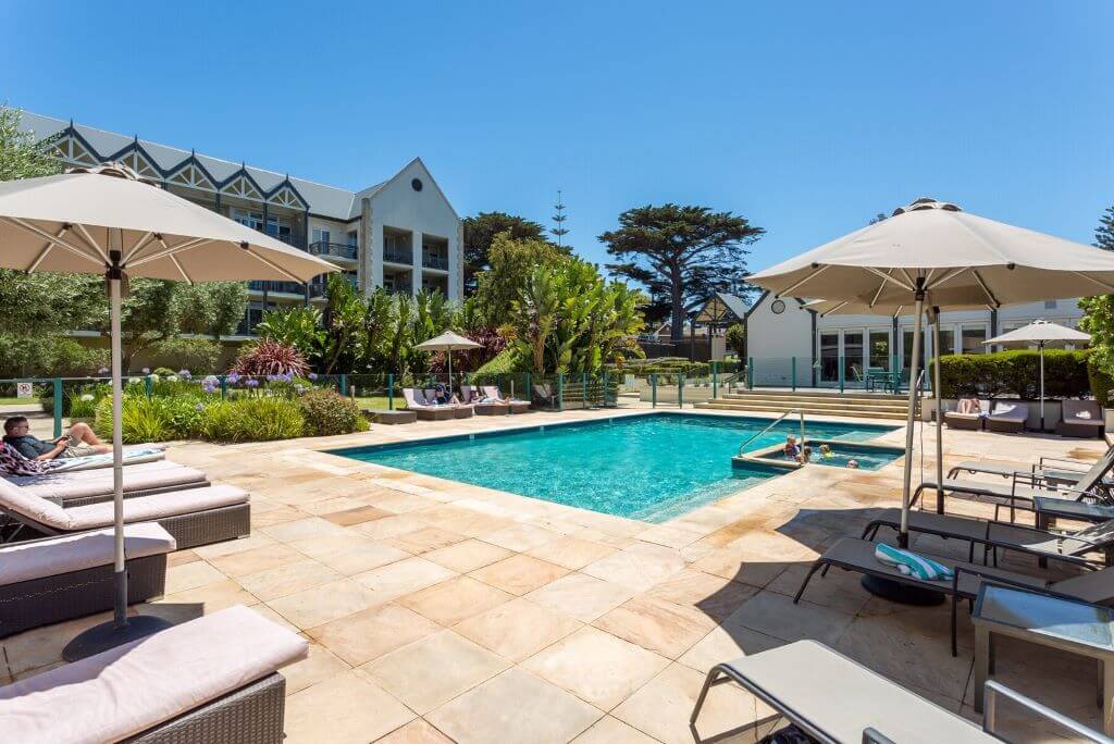 Relaxing by the pool at Portsea Village Resort