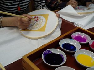 craft class making floral design on napkin