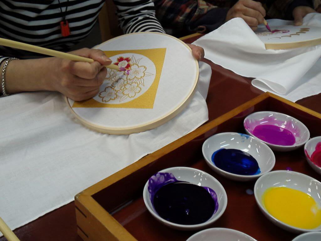 craft class making floral design on napkin