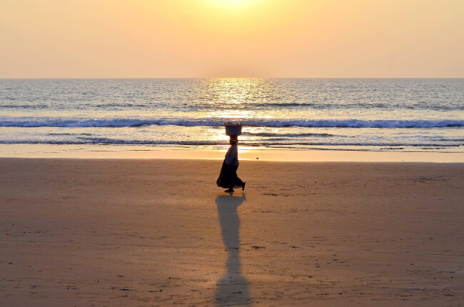 Woman walking on Goan beach