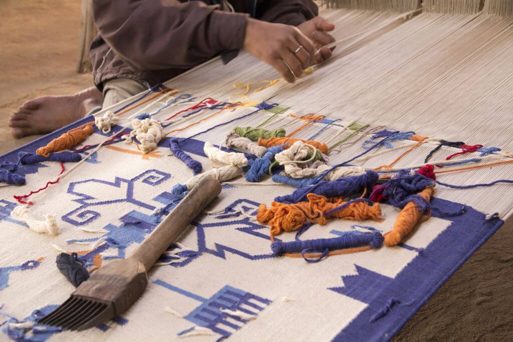 textile artist weaving cotton and embroidery in Udaipur India