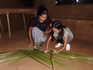 Hiriwaduna locals weaving leaves in Habarana Sri Lanka