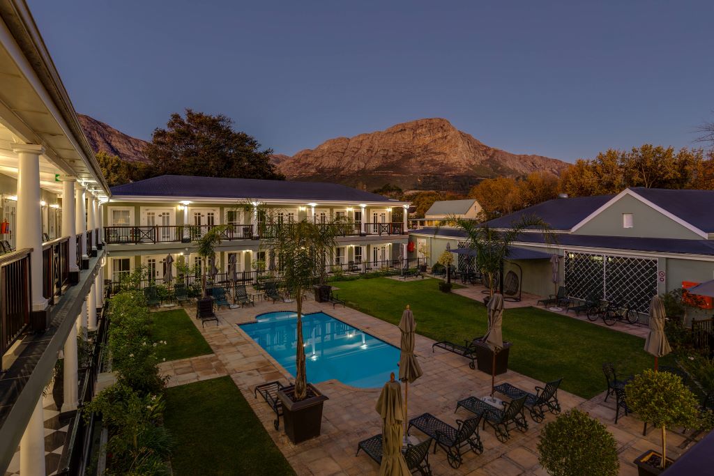Protea Marriott Franschhoek evening view of swimming pool and grounds