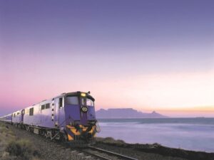 Blue Train at dawn with Table Mountain in background