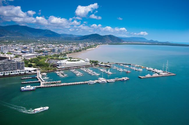 Cairns aerial view of harbour with boats in the water and hills in the background