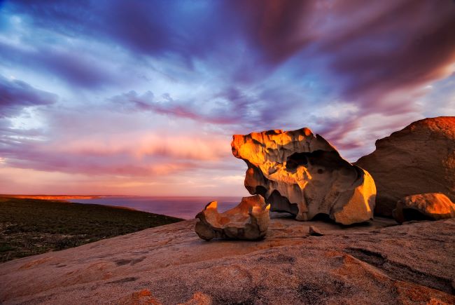 Remarkable Rocks on Kangaroo Island, around sunset with sunlight on and dark clouds 