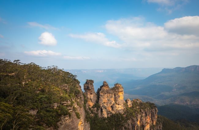 Three Sisters in Blue Mountains, with slight mist over valley in the background 