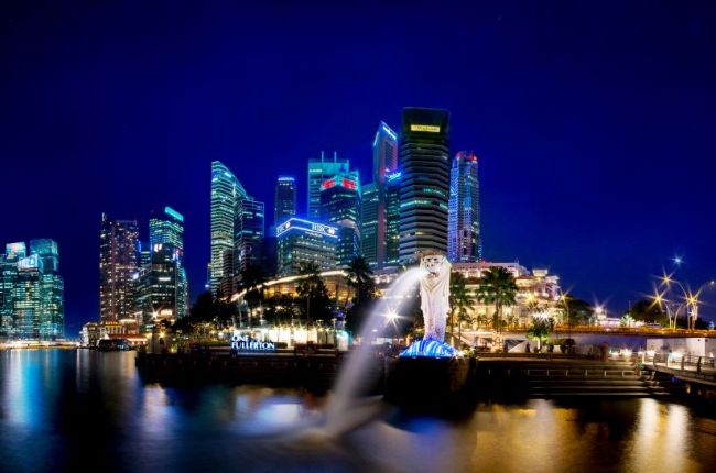 Singapore skyline at night with Merlion