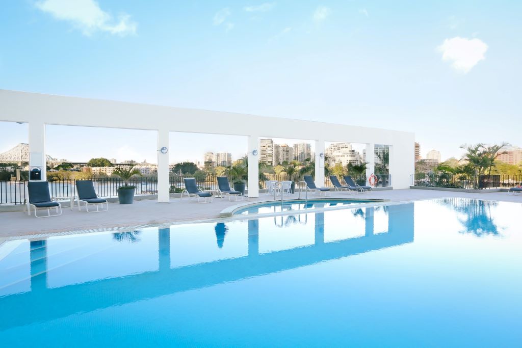 Stamford Plaza Brisbane pool area with city in background