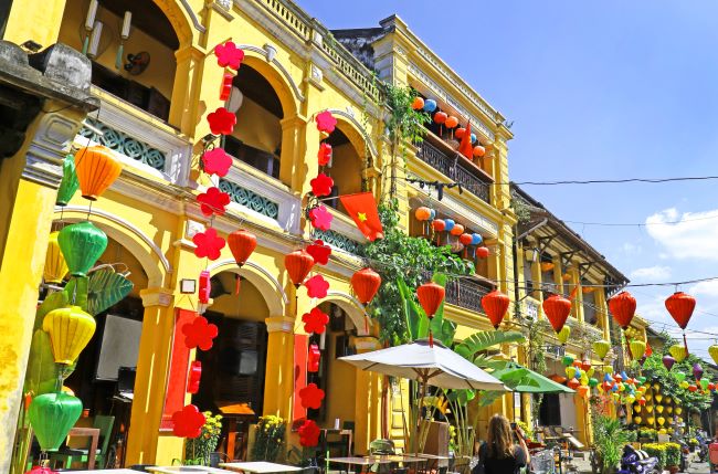 Brightly coloured buildings and lanterns in the historic town on Hoi An in Vietnam