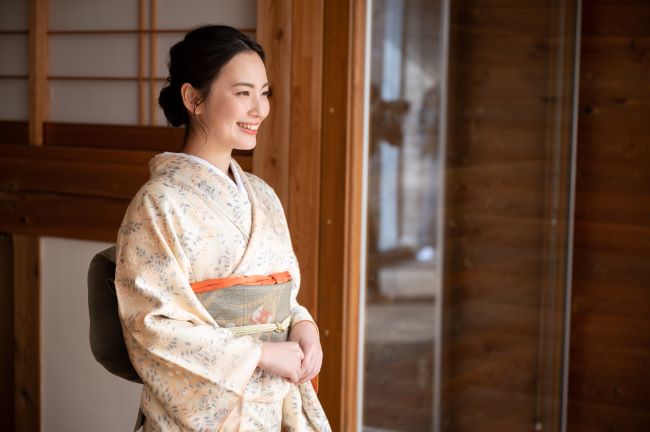 Smiling Japanese lady in traditional kimono