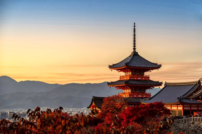 Kiyomizudera Temple at sunset surrounded by autumn colours, Kyoto, Japan