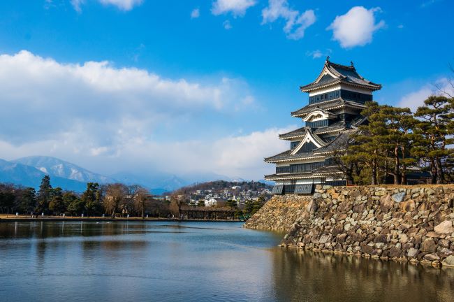 Beautifully preserved Matsumoto Castle in Nagano Prefecture with Japanese Alps in the background