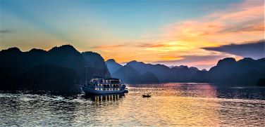 Overnight boat in Ha Long Bay at sunset.