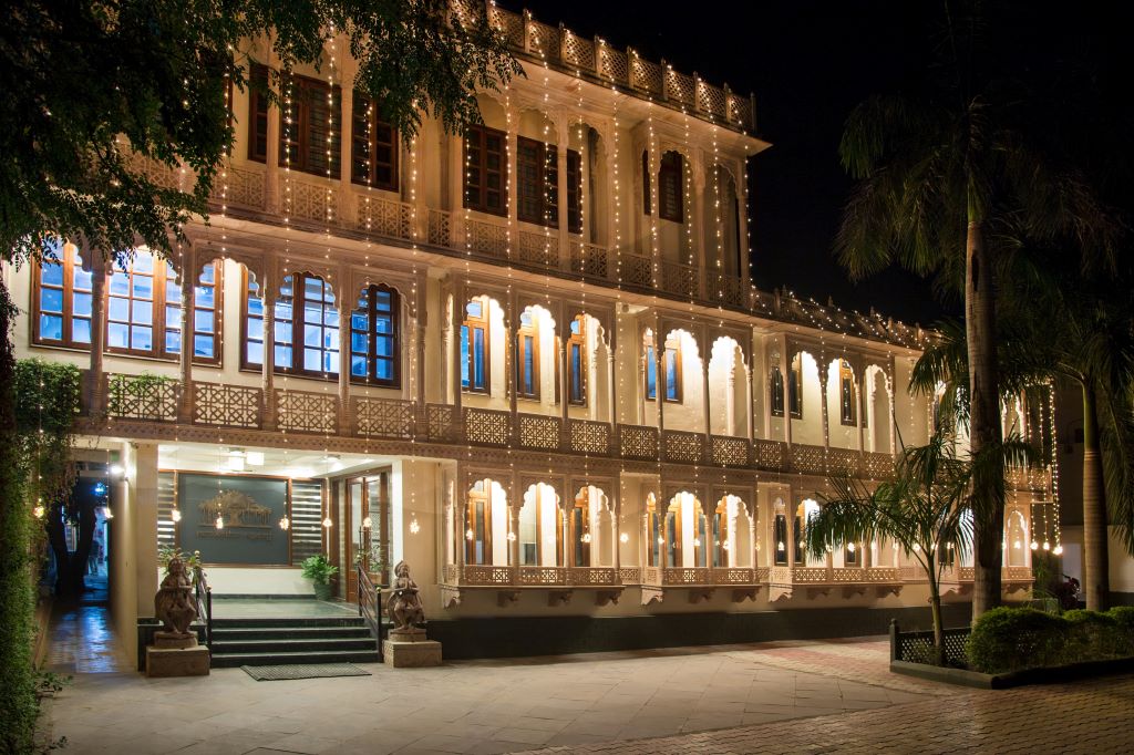 Brightly lit exterior of the Regency Ranthambore Hotel in Delhi