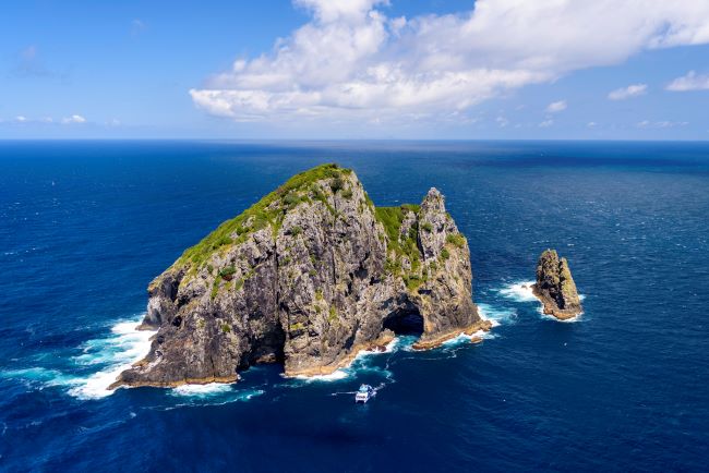 Boat about to go through the 'Hole in the Rock', Bay of Islands, New Zealand