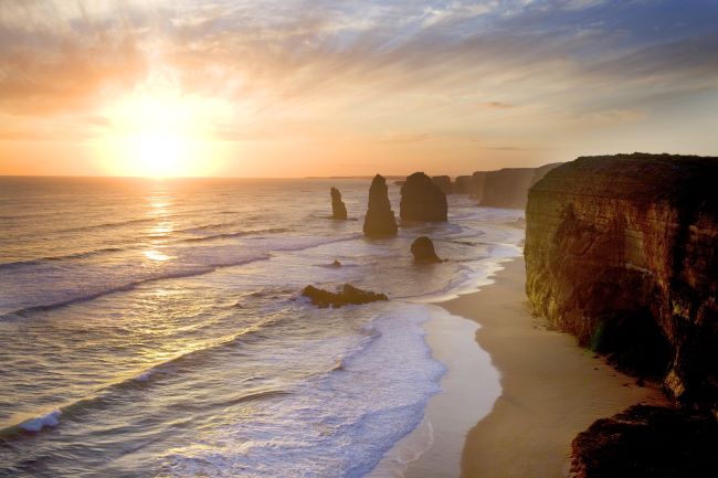 Dramatic sandstone pillars rising out of the sea. Known as the Twelve Apostles and part of the dramatic coastal drive, the Great Ocean Road in Victoria, Australia