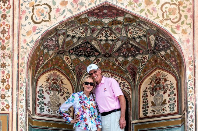 Couple smiling for the camera at Amber Fort Jaipur