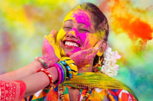Young Indian Lady celebration Holi Festival, India