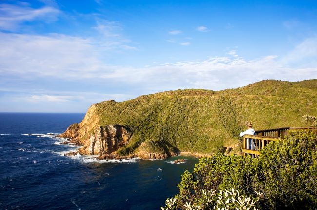 Lady looking out over Knysna Head in Knysna, South Africa