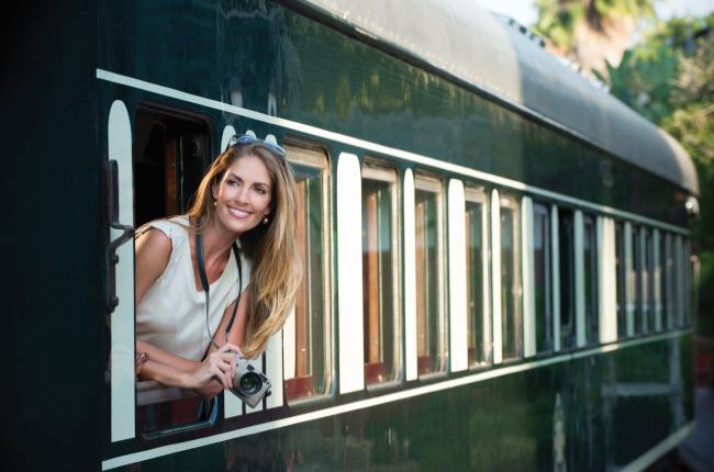 Lady looking out of Rovos Rail train window