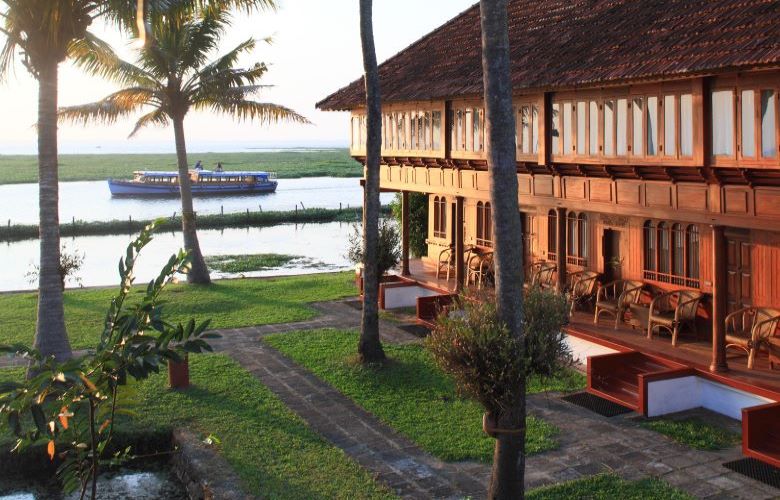 Exterior of hotel grounds and lake at Coconut Lagoon, Kerala