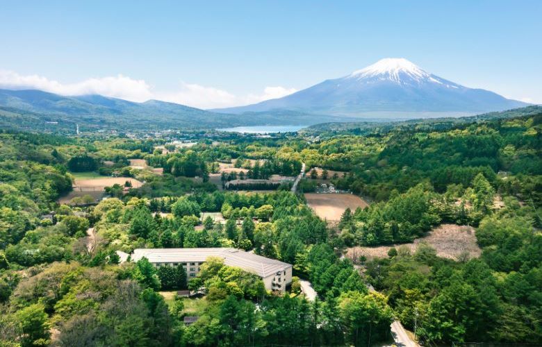 Aerial of Marriott Hotel with a snow-capped Mount Fuji and Lake Yamanaka in the background