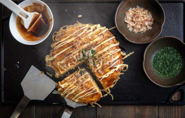 Okonomiyaki a traditional savory pancake, famoun in Hiroshima, Japan