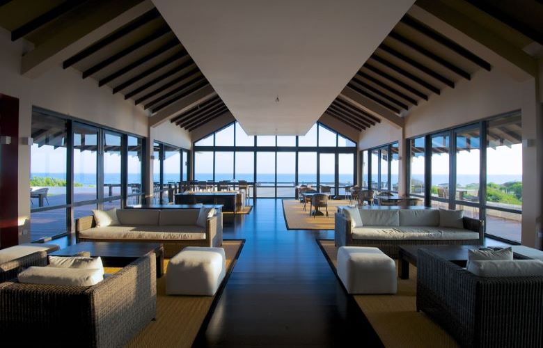 Open lounge of hotel with floor to ceiling glass, Jetwing Yala, Sri Lanka