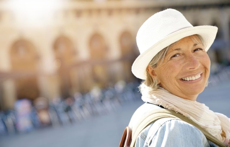 Senior lady wearing backpack