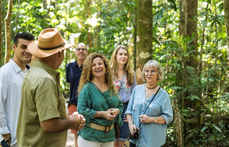 Group of tourists with guide in the rainforest