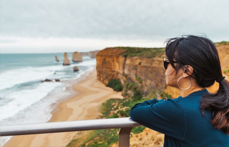 Lady looking out over the twelve apostles on the great ocean road