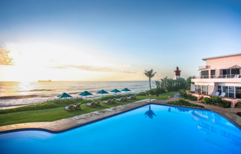 Swimming pool by the edge of the ocean at the Beverley Hills Umlanga, South Africa